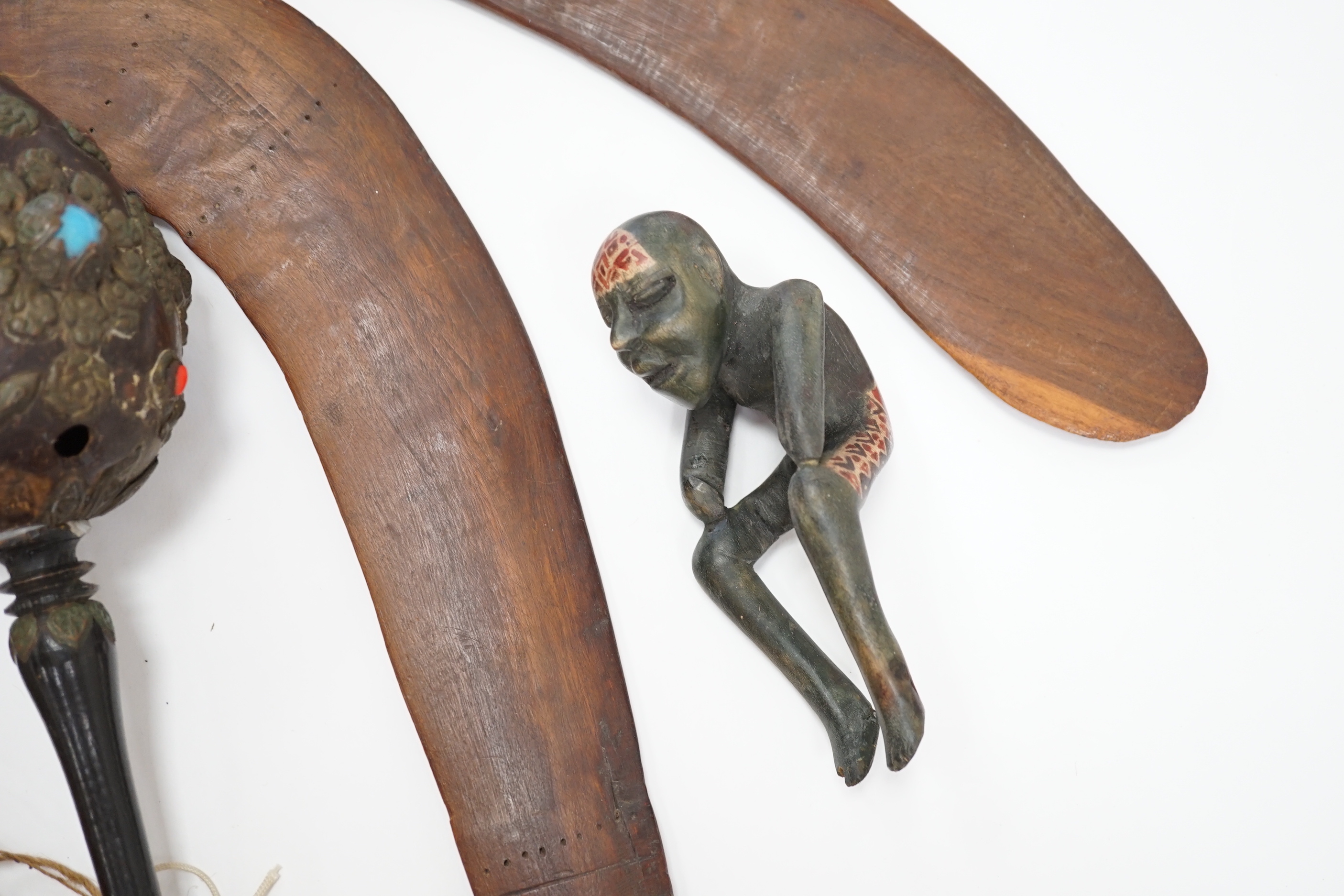Two Aboriginal boomerangs, an African mask, a painted lion figure and four other items (8)